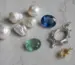 Freshwater cultured pearls, blue and green gemstones, sterling silver, and gold settings